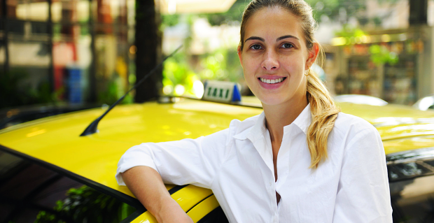 Smiling female taxi driver