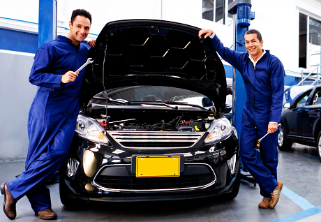 Car mechanics smiling